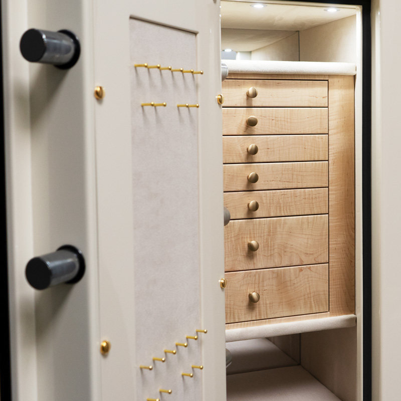 Interior Close Up of Finch - Emerald Jewelry Safe in Warm Cream with 7 Drawers in Curly Maple, Brass, Champagne, Neck Panel