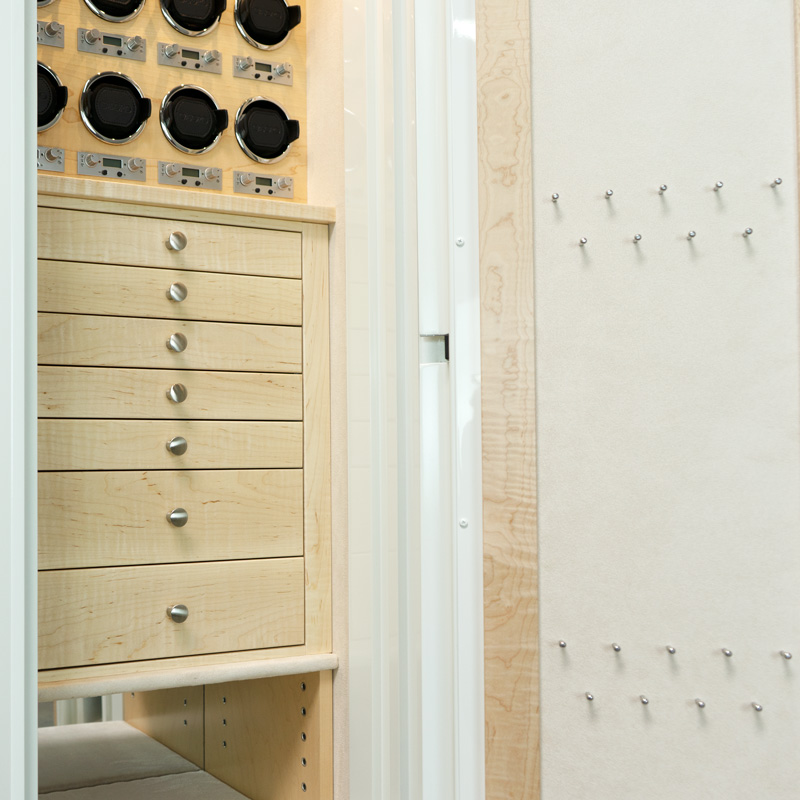 Close up of Drawers in Emerald TL15 Jewelry & Watch Safe in Alabaster White, 7 Curly Maple Drawers, Satin Chrome Hardware, Champagne Microsuede, 8 Watch Winders, Necklace Panel